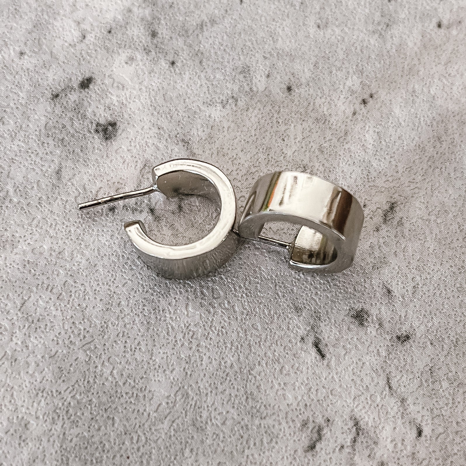 JustOne's silver small hoops that hug your ear, handcrafted in Kenya